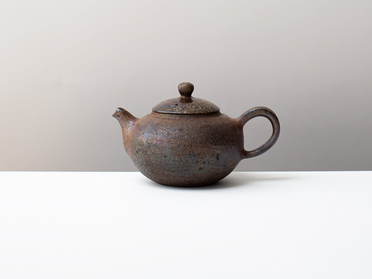 Curvature, wood-fired teapot.
