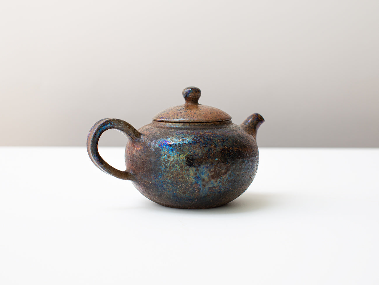 Curvature, wood-fired teapot.