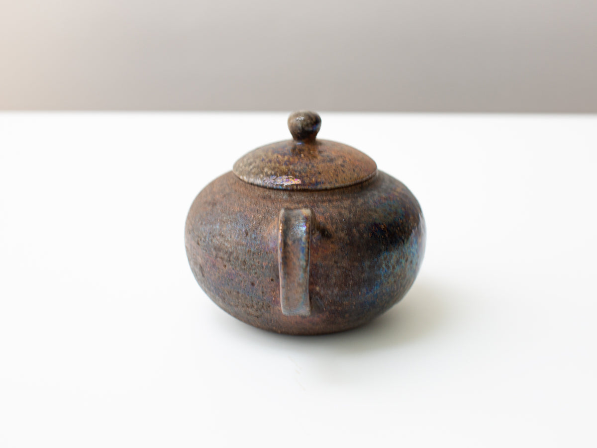 Curvature, wood-fired teapot.