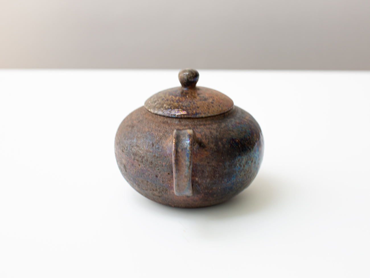 Curvature, wood-fired teapot.